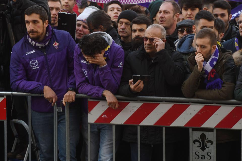 One fan finds the moving scene all too much as he weeps into his hand