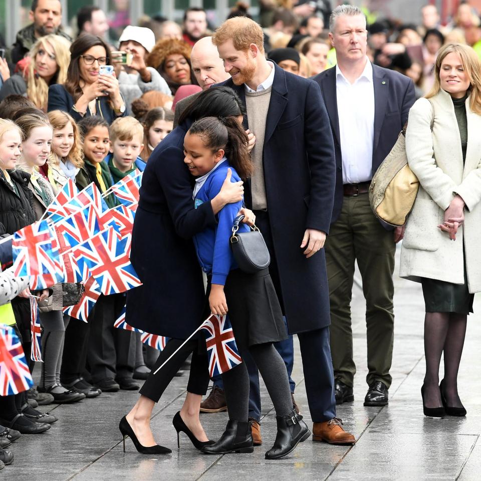  Meghan Markle hugs a starstruck young girl in Birmingham