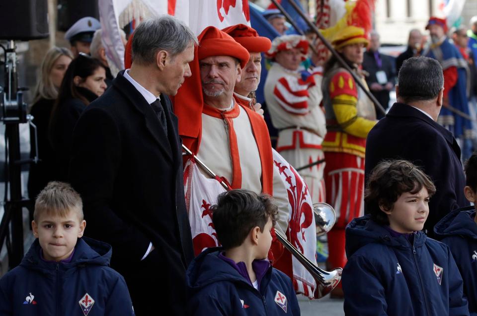 AC Milan legend Marco van Basten chats to a man in traditional Florentine dress