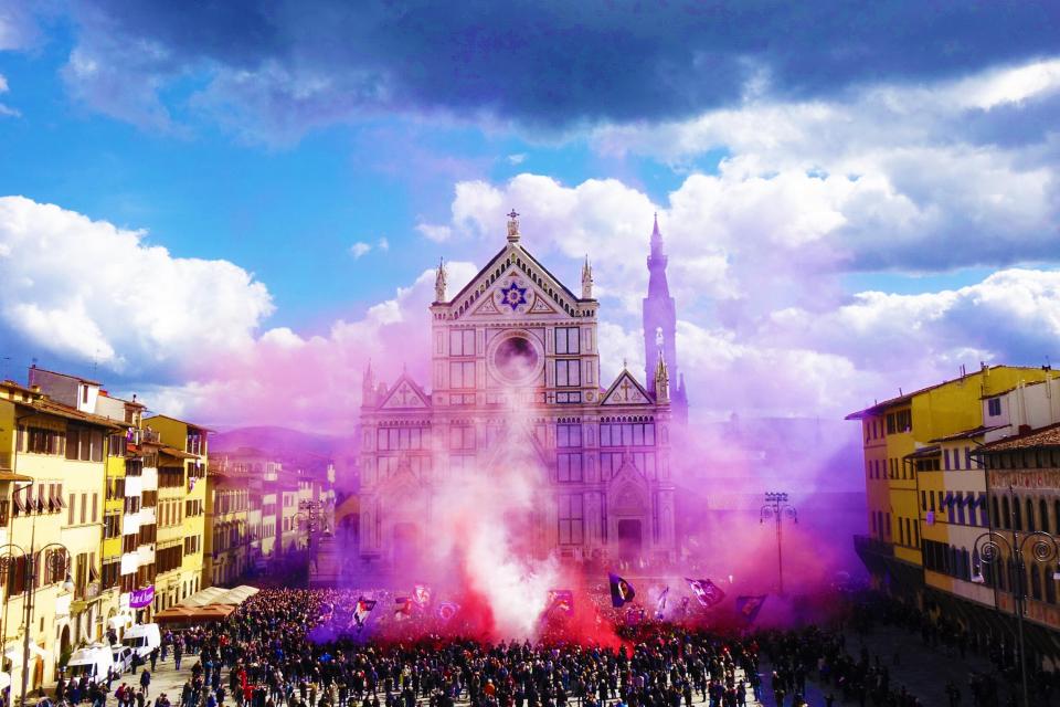 The incredible sight of several flares were let off in the spring sunshine in Astori's honour outside the Basilica di Santa Croce