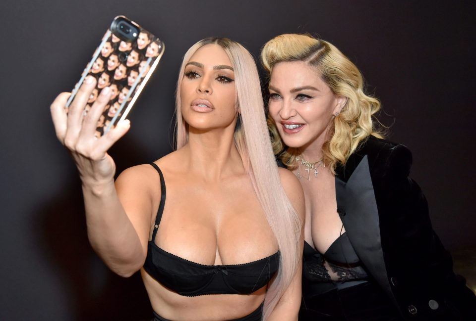  Kim couldn't resist snapping a selfie with the pop legend