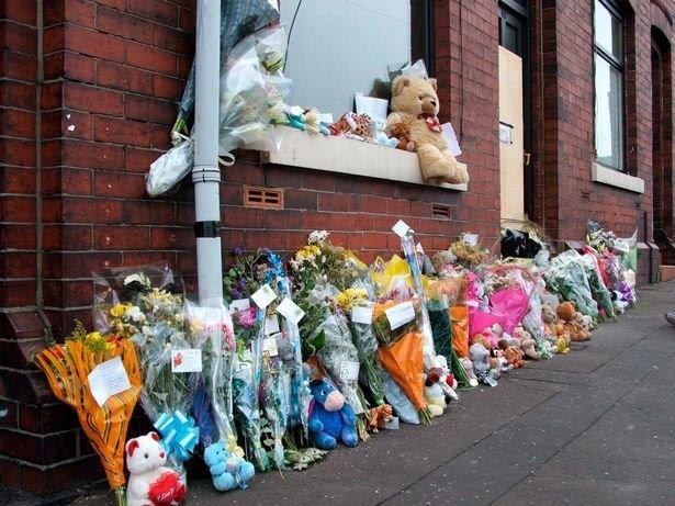  Flowers at the scene of the house fire in which Natasha's youngest brother Alan and step sister Layla died