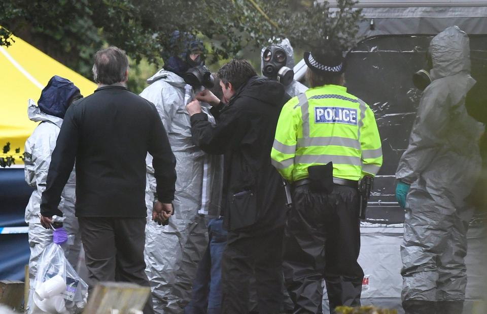  Forensic police officers work at a grave site in Salisbury Crematorium