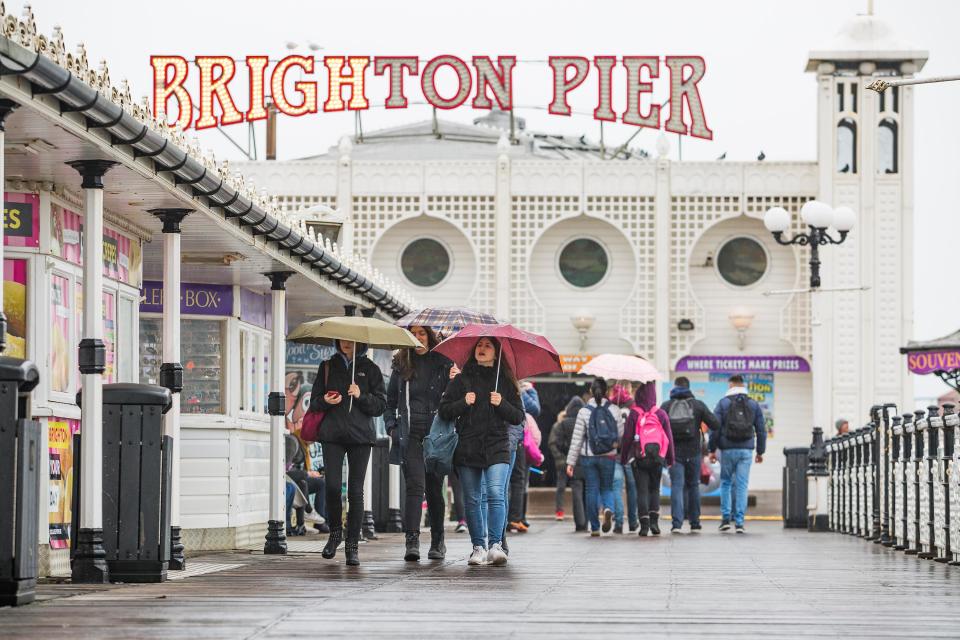  Brighton also saw its fair share of rain today, but the pier still drew visitors