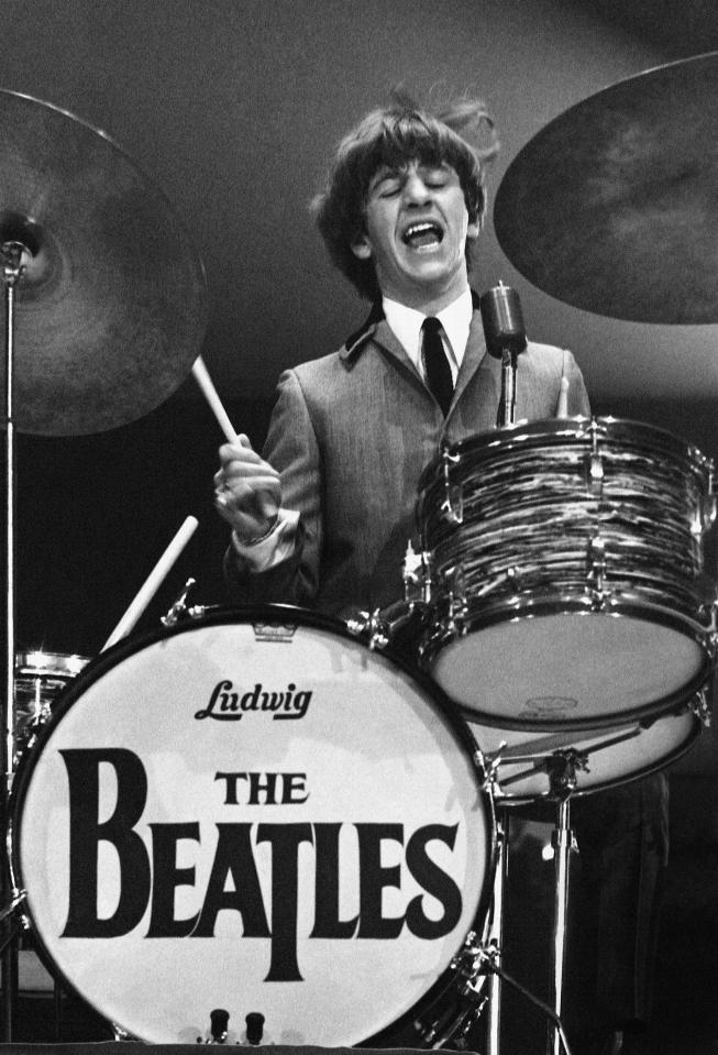 Ringo performs with The Beatles during a US tour in 1964