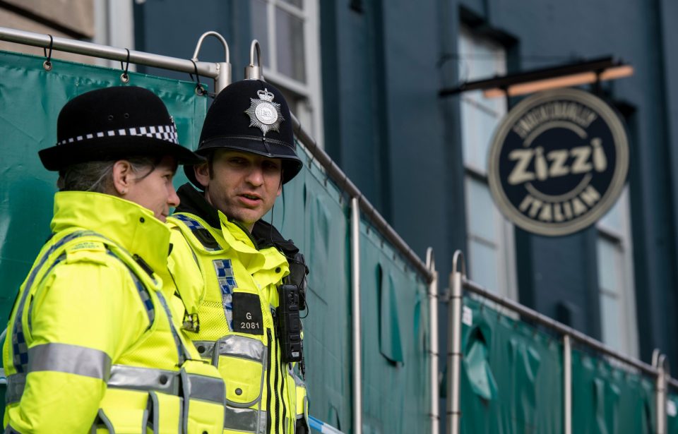  Officers guard the cordoned off Zizzi restaurant in Salisbury