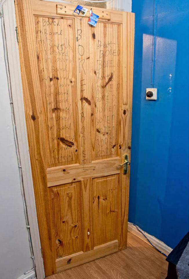  The door of Hassan's bedroom in Surrey had the word bored scrawled over it repeatedly