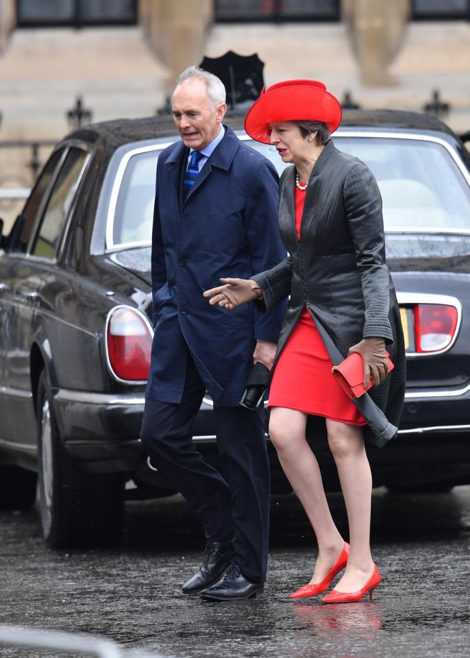  Theresa May was spotted wearing a red dress and a red hat when she arrived at the event