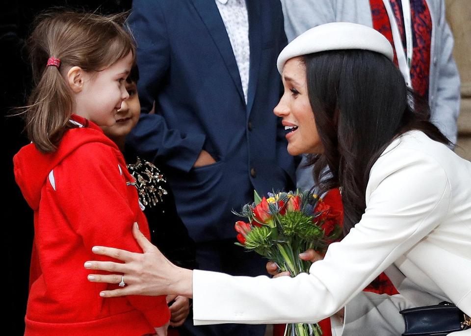  Meghan was given flowers when she left the event