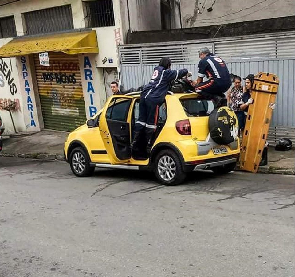  It took three paramedics to remove the motorbiker from the roof of the car