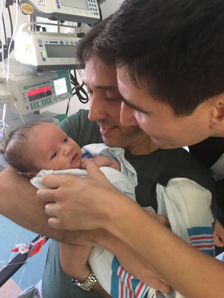  Mariano and husband Gonzalo holding son Nikolas just after he was born