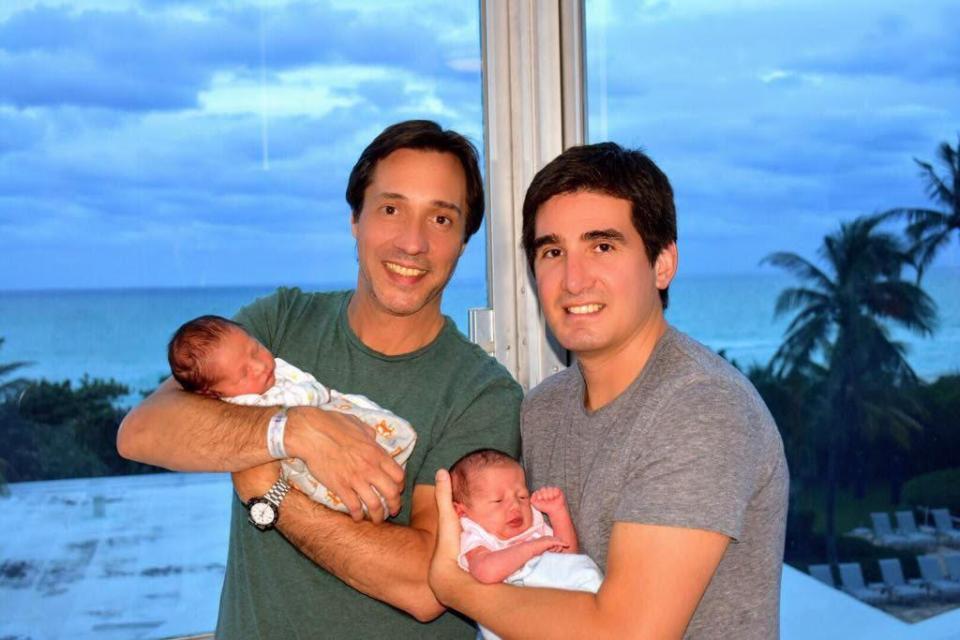  Mariano Trench, left, and husband Gonzalo Neris, right, holding their newborn twins before the horror crash