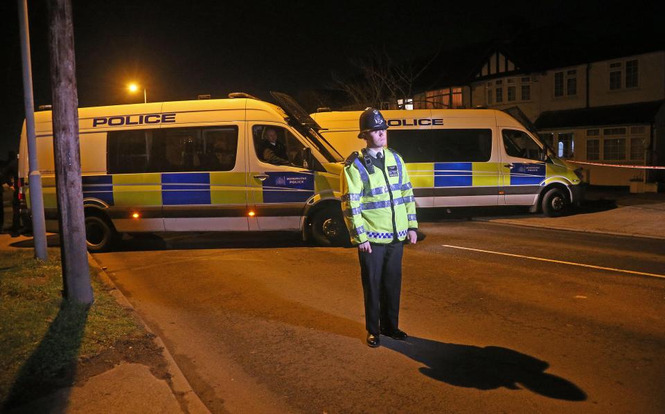  A blue tent obscured the entrance to the terraced house in New Malden, Surrey, on Monday, as police kept watch