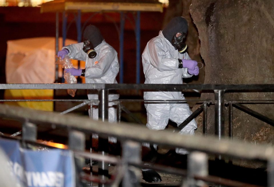  Forensics officers in radiation suits work at Sergei Skripal's home