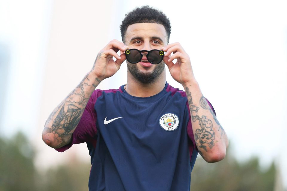 Kyle Walker dons a pair of sunglasses in the Middle Eastern heat