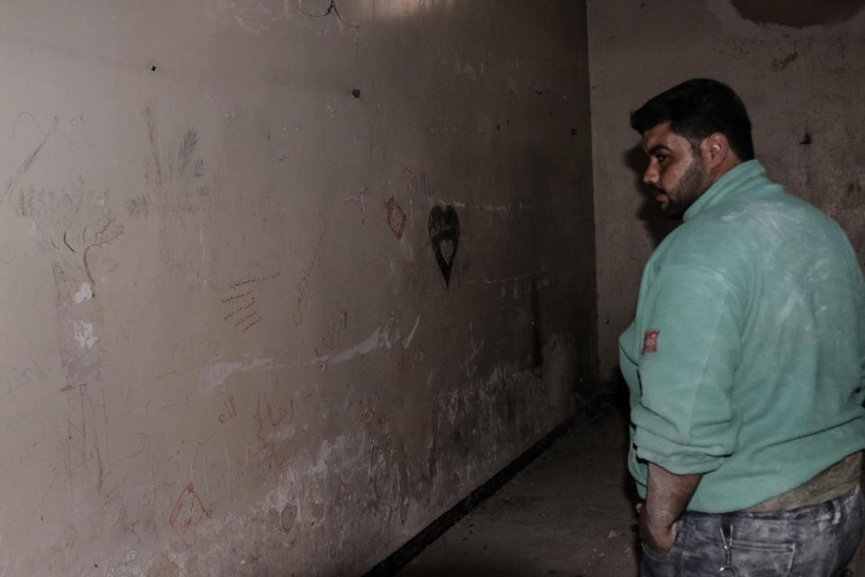  Rambo gives a tour - where ISIS graffiti remains on the walls