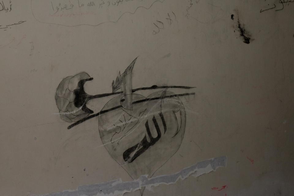  ISIS graffiti on wall of torture room