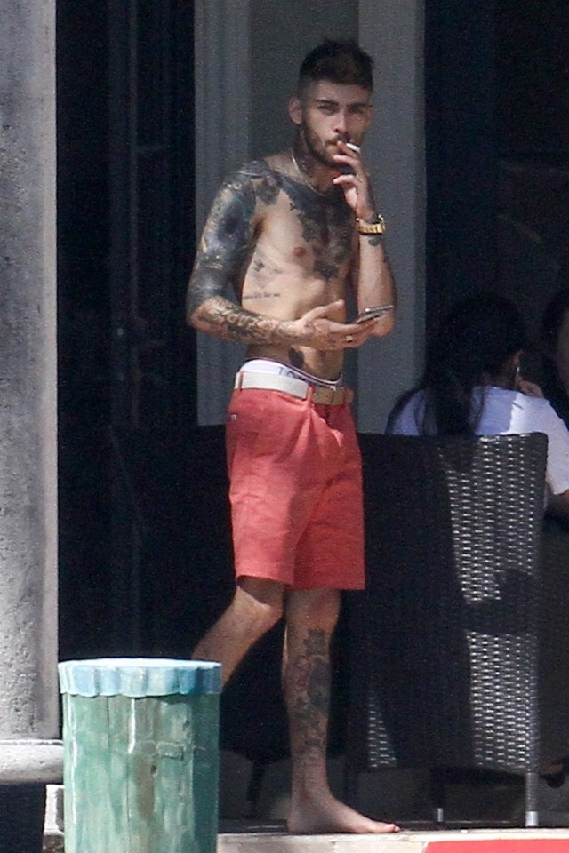 Zayn Malik looked downcast while wandering around a pool in Miami on Wednesday