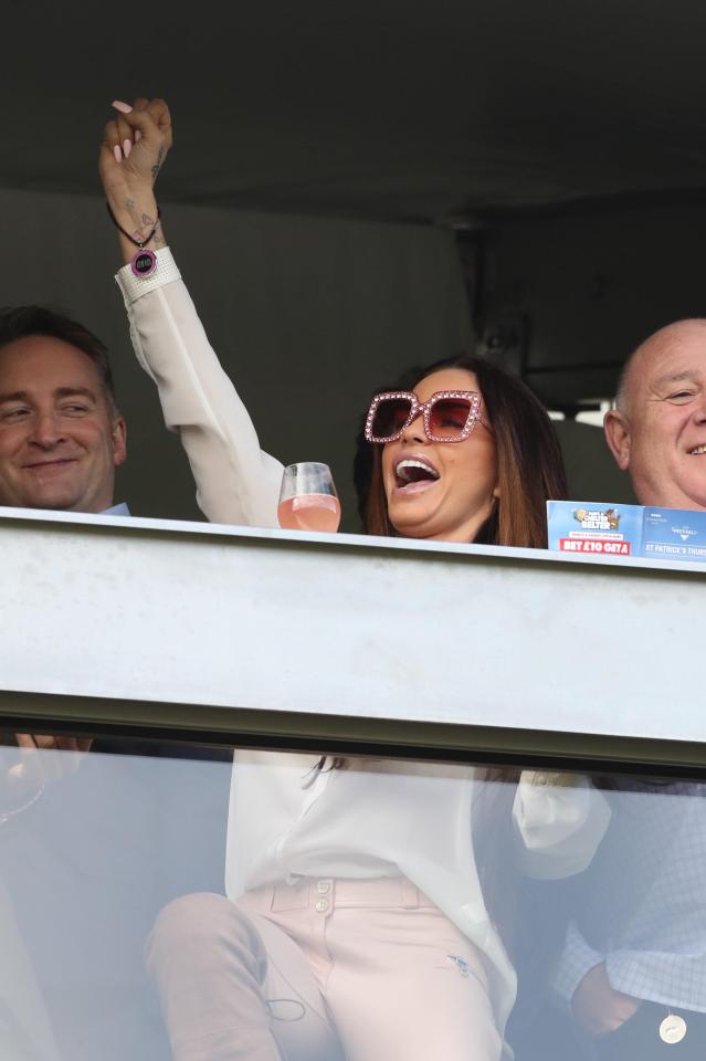  Katie was seen cheering on the runners from the stands