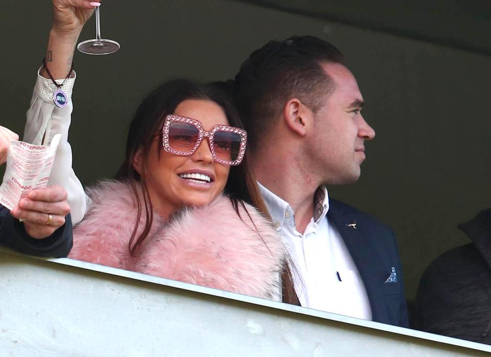  Katie Price raises a glass after the running of The Sun Bets Stayers Hurdle race