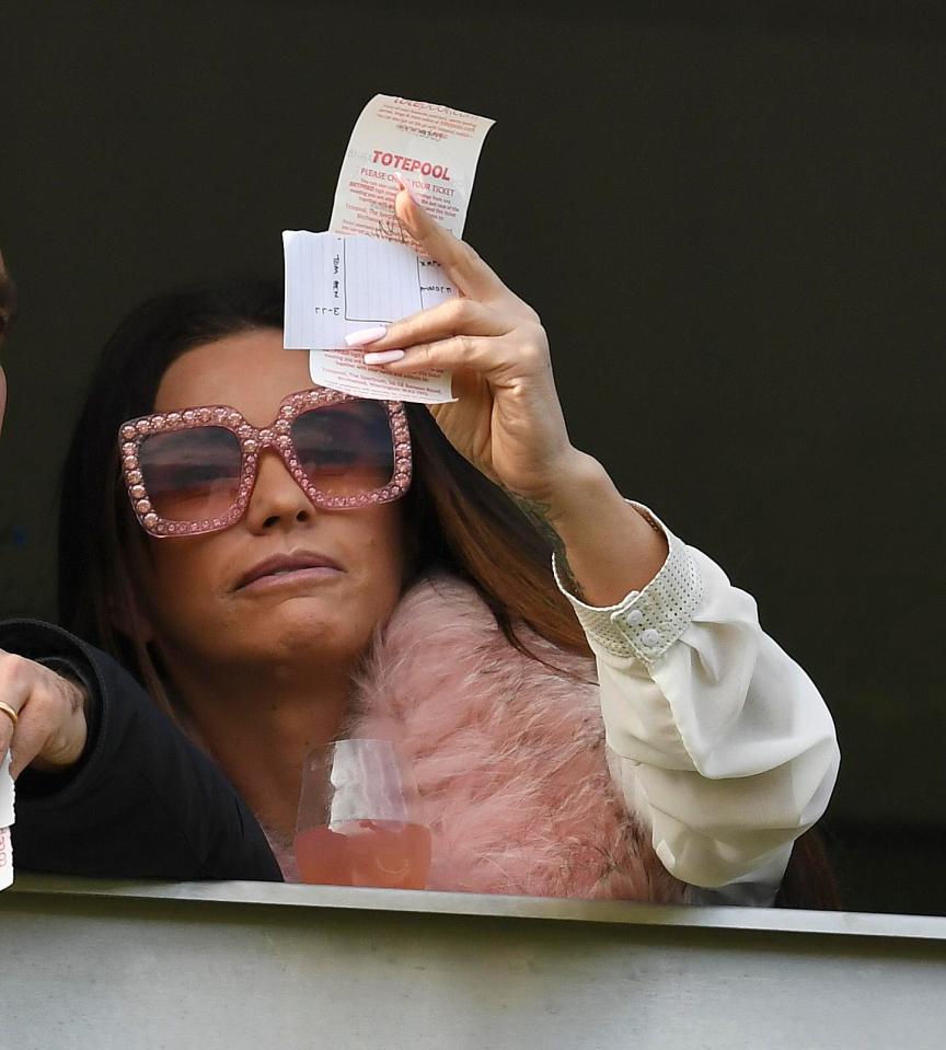  Katie checked her coupon from behind her shades