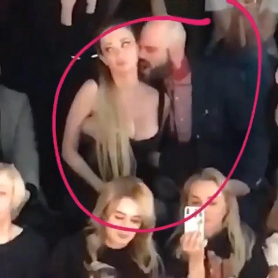  Yulia Berg and Dimitry Torin, pictured above. The pop star has furiously denied she was performing a sex act during the fashion show