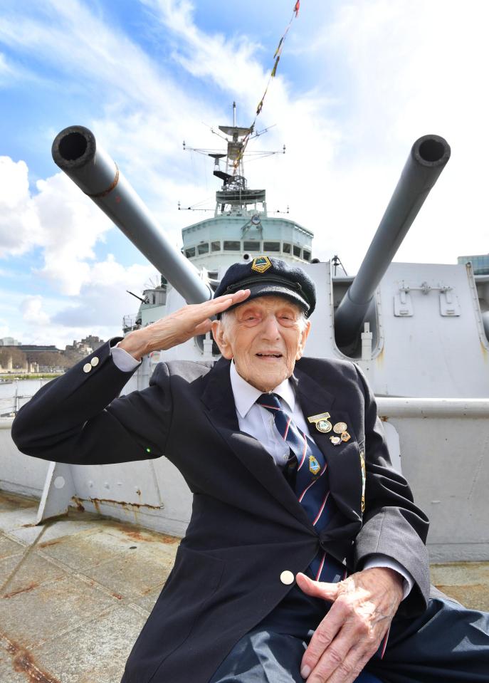  John Harrison aged 104, sits on the foredeck of HMS Belfast in front of gun turret A, which he commanded during the Second World War, as veterans who served on the warship in the 1940s, 1950s and 1960s meet aboard the historic ship on the River Thames in London to mark its 80th anniversary