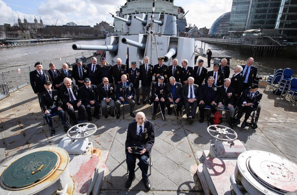  John Harrison, front, and other HMS Belfast veterans step back on board today to celebrate the ship's 80th anniversary