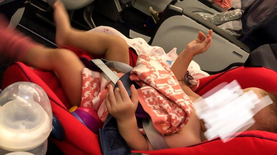  She claims she was turfed off by cabin crew for changing her baby's smelly nappy