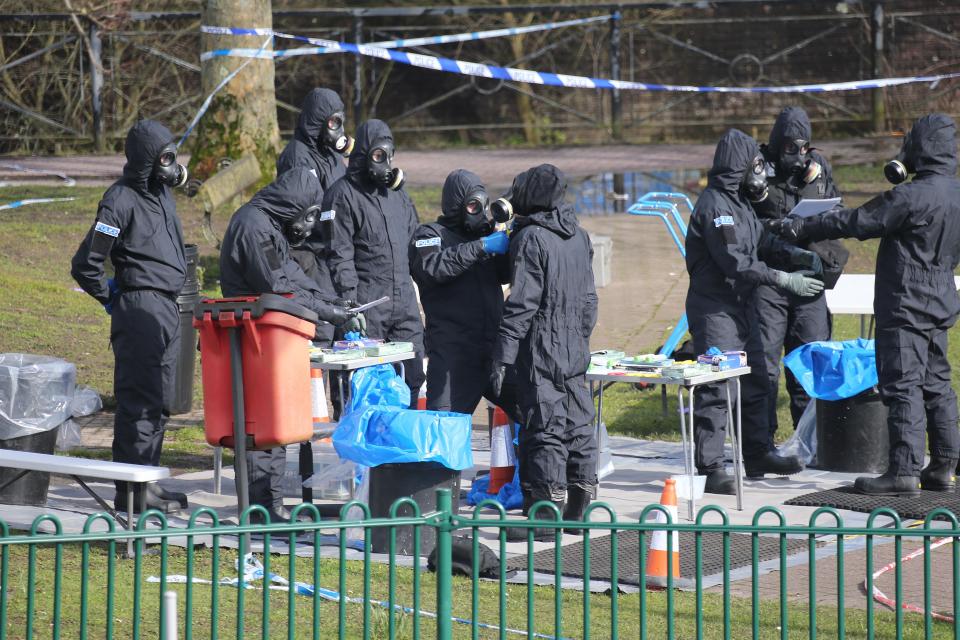  Police wearing protective gas masks as they investigate the site where Sergai Skripal and his daughter were poisoned with a nerve agent that the British Government firmly believes was ordered by Putin and the FSB