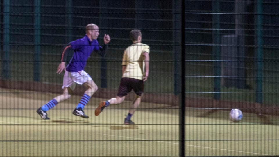  The prince fights off an opposition player in yellow to win the ball