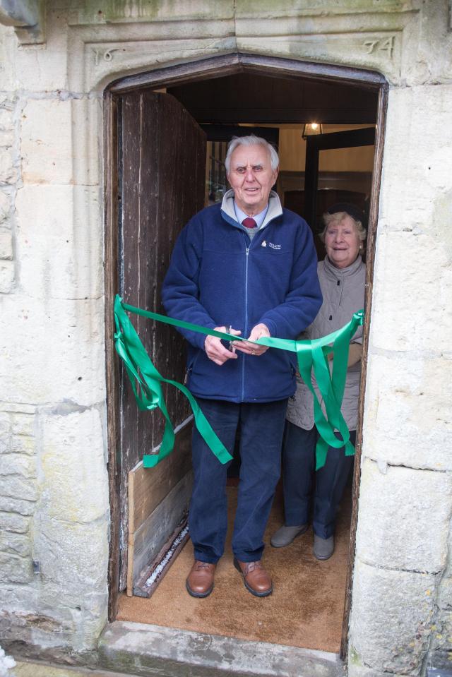  Brian Perkins who was born in the pub, cuts the ribbon