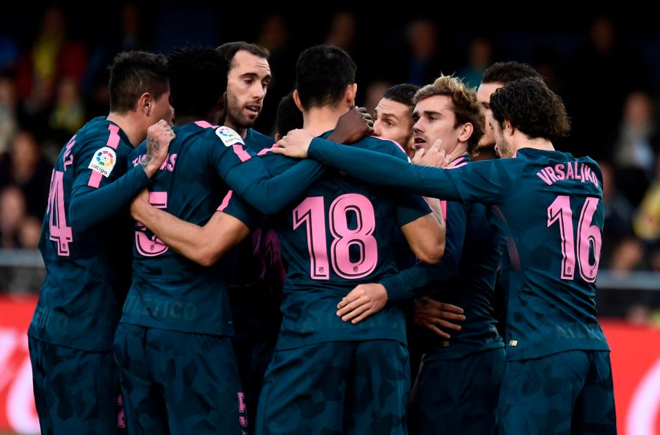  The 26-year-old celebrates with his team-mates after netting against Villarreal