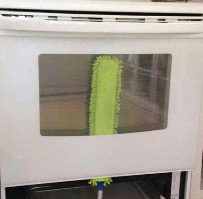  Ovens often have a slot to help you clean and you can use a skinny mop to get rid of built up gunk