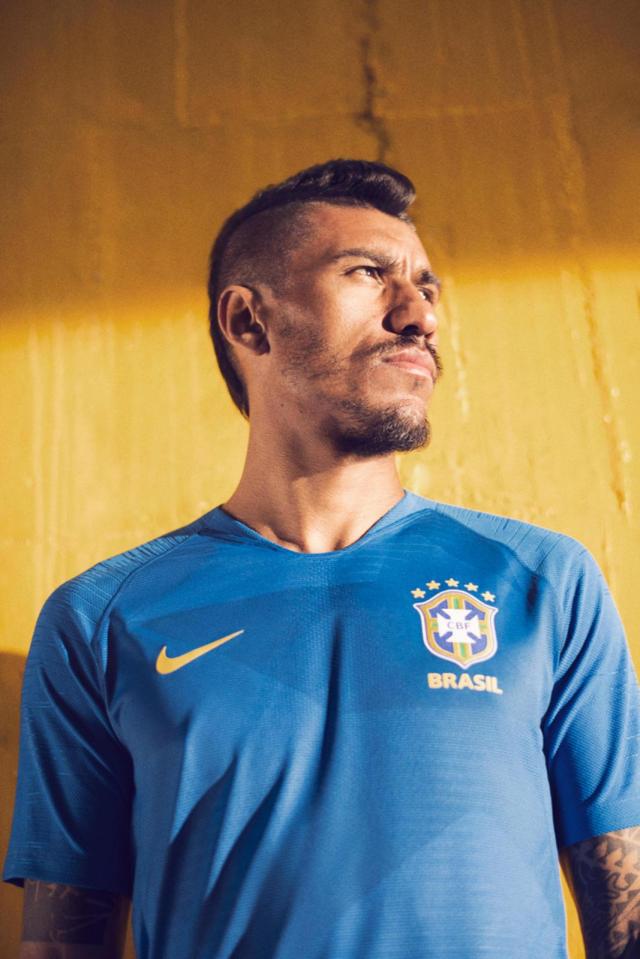  Former Tottenham midfielder Paulinho models the blue away kit, which pays homage to their triumph in 1958