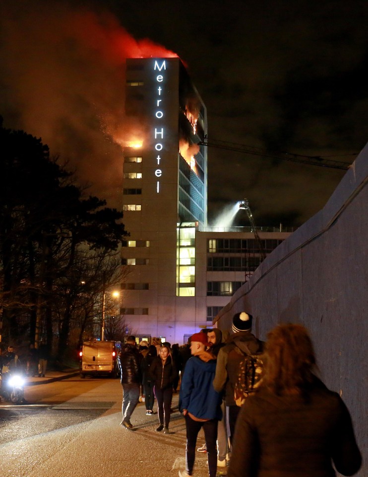 Shocked witnesses watched on as the hotel went up in flames