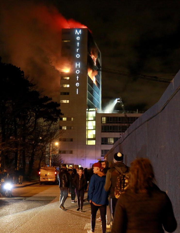  Shocked witnesses watched on as the hotel went up in flames