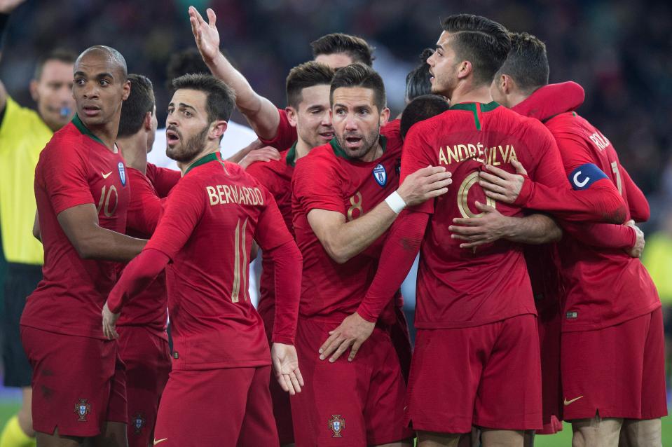  Portugal players react after Ronaldo's header was ruled out for offside