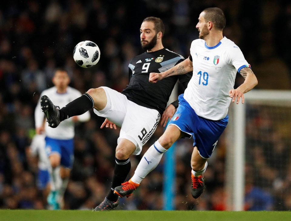 Argentina striker Gonzalo Higuain tussles with Italy’s Leonardo Bonucci at the Etihad