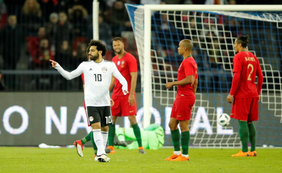  The Liverpool star celebrates his strike against the Euro 2016 winners during the second half