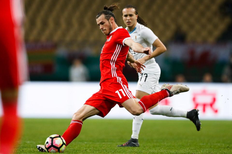  Gareth Bale tries a pot shot from distance for Wales