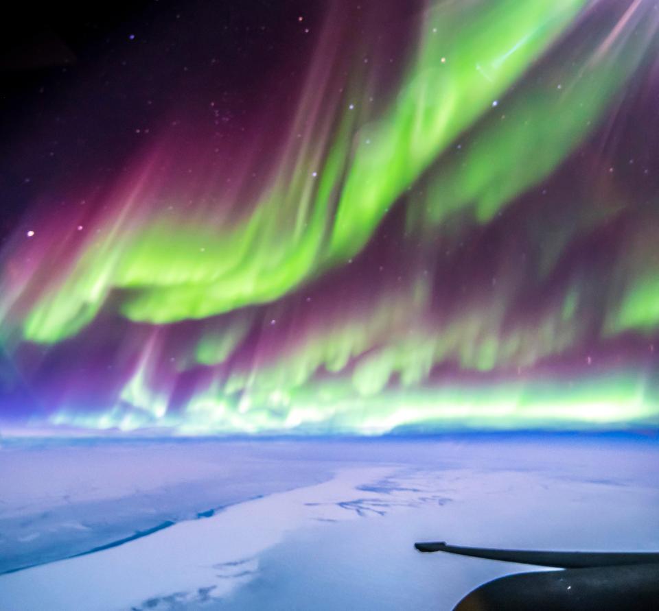 Ross Franquemont couldn't believe his luck as he captured a series of stunning photographs while flying right through the aurora