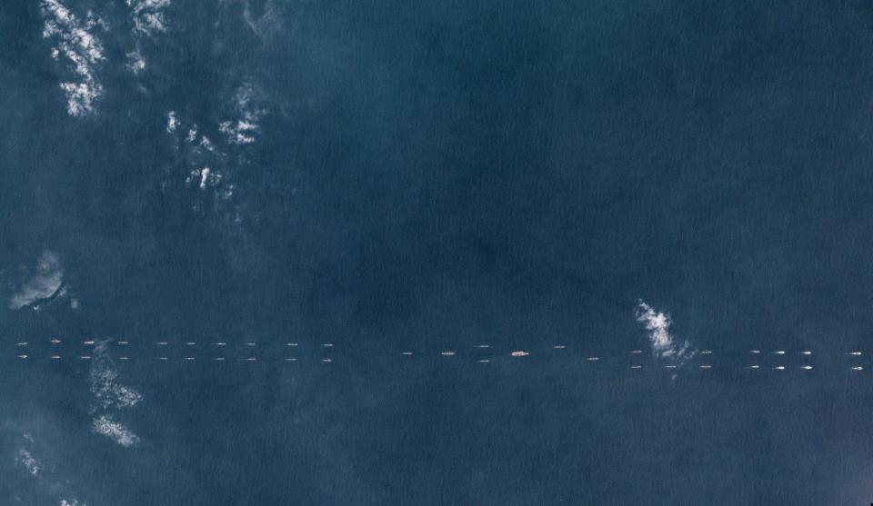  The photos, taken on March 26, show what appear to be at least 40 ships and submarines flanking the carrier Liaoning in the South China Sea as part of massive war games