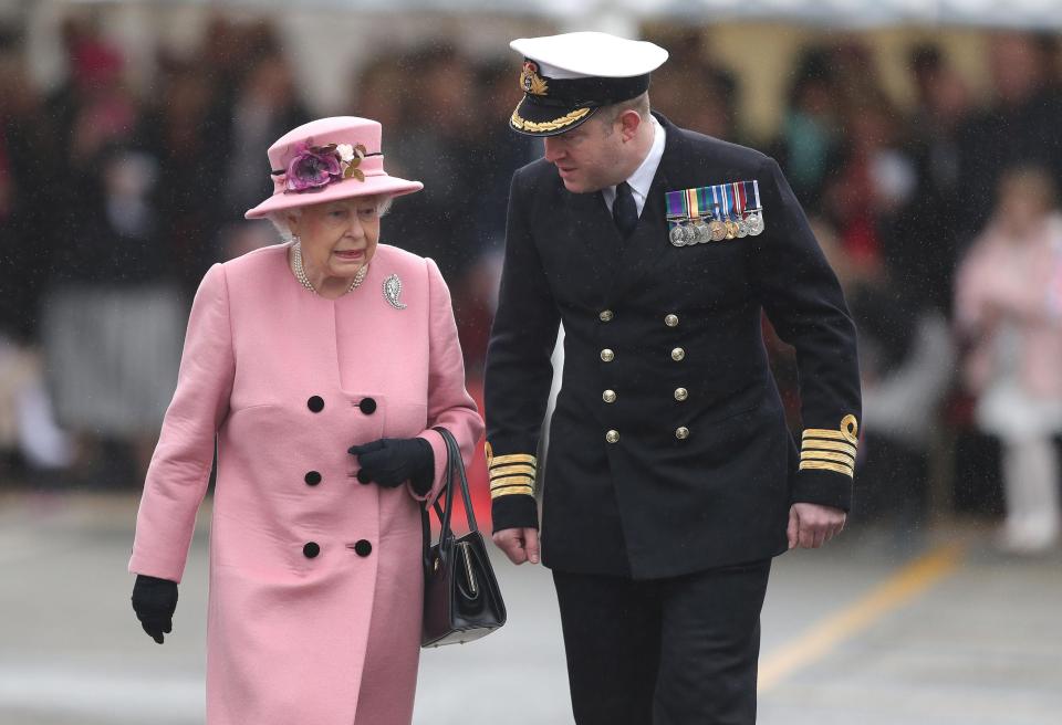  Queen Elizabeth II and Captain of HMS Ocean Captain Rob Pedre