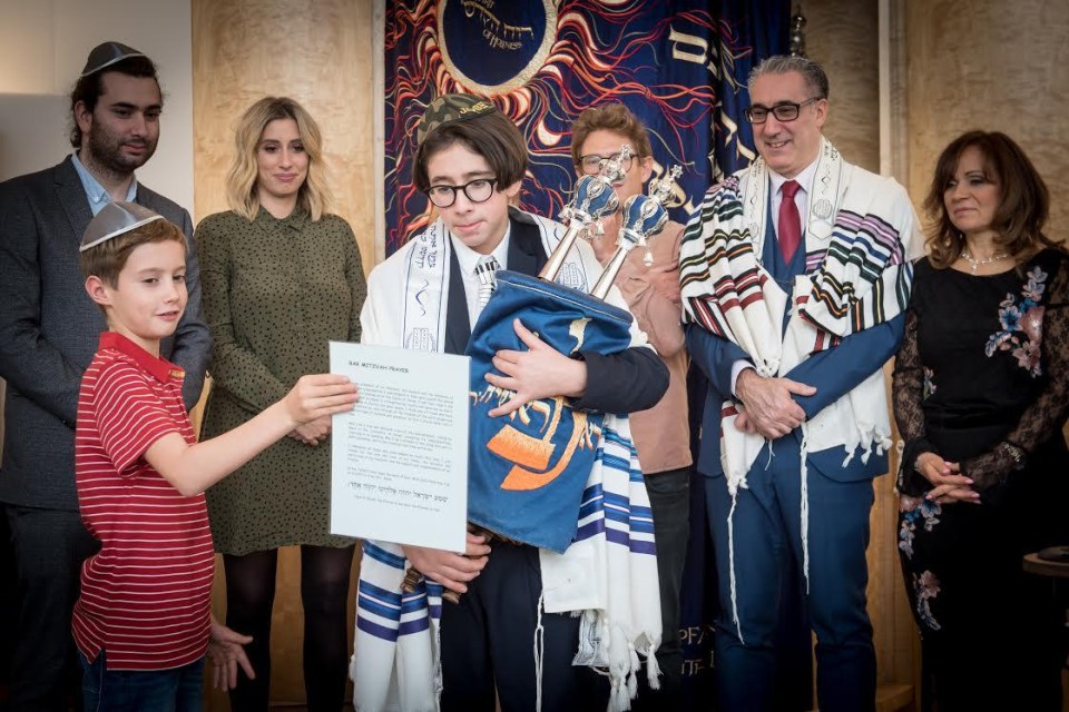 Stacey, pictured in green, and her family pictured at brother Josh’s Bar Mitzvah