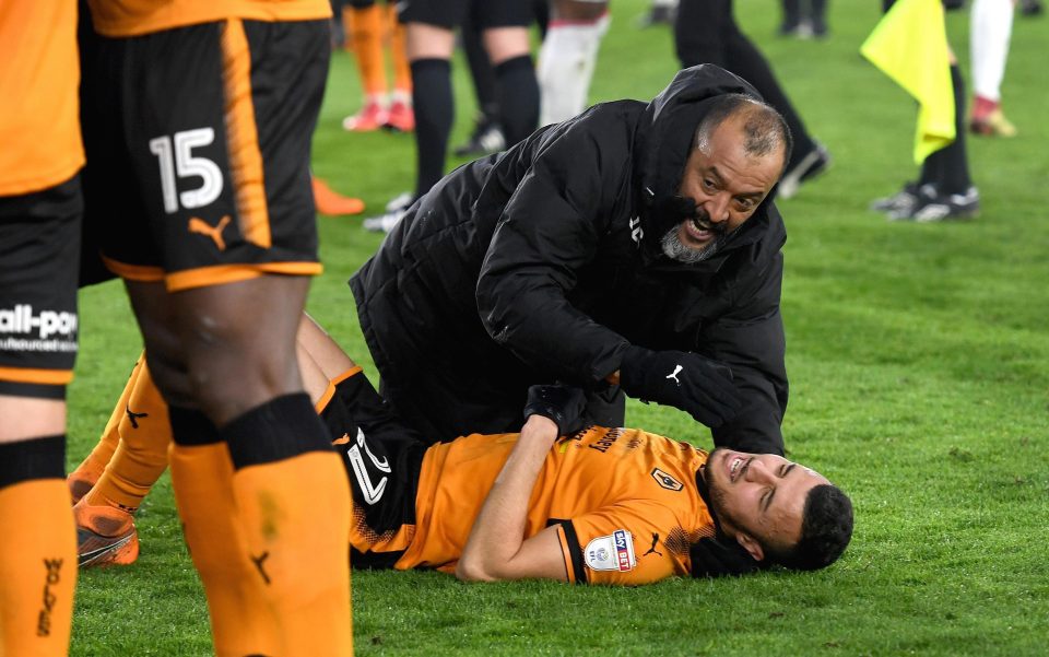  Wolves boss Nuno celebrates with defender Romain Saiss after his team held on for the win