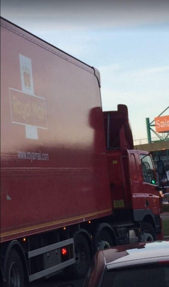  The Royal Mail lorry then drives around the roundabout - with the back wide open