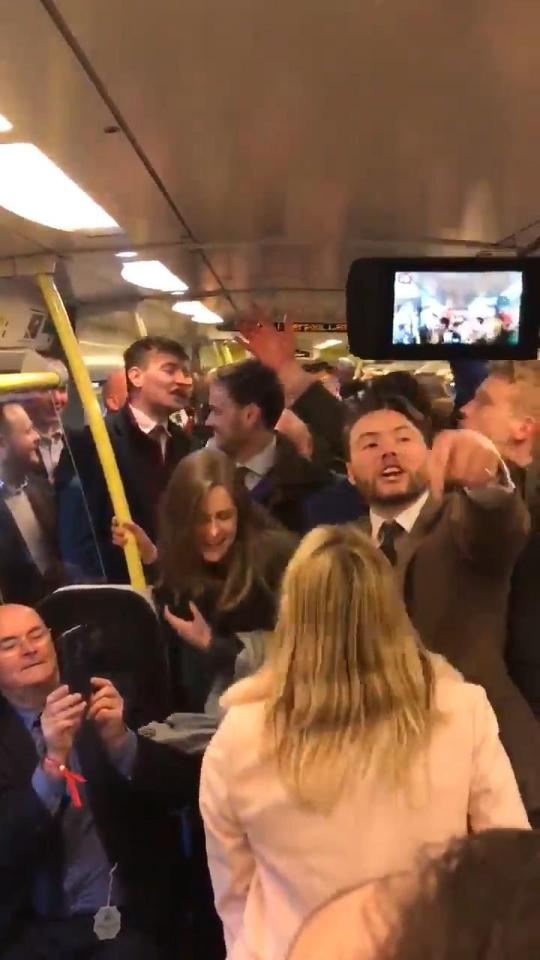  Revellers bounce and dance on the train home after a day at the races