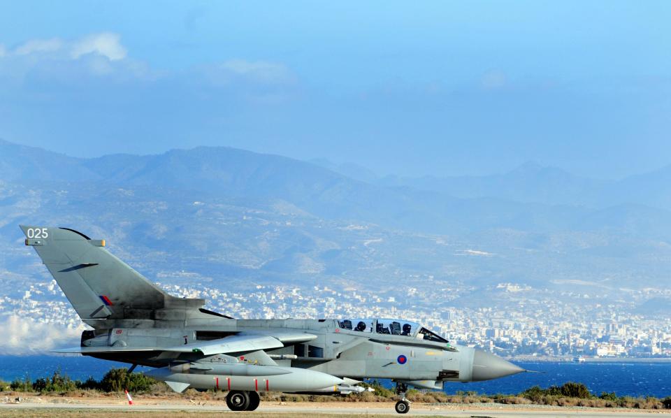 RAF bombers at Britain's base in Cyprus are said to be on standby to strike Syrian President Bashar al-Assad after major activity was reported