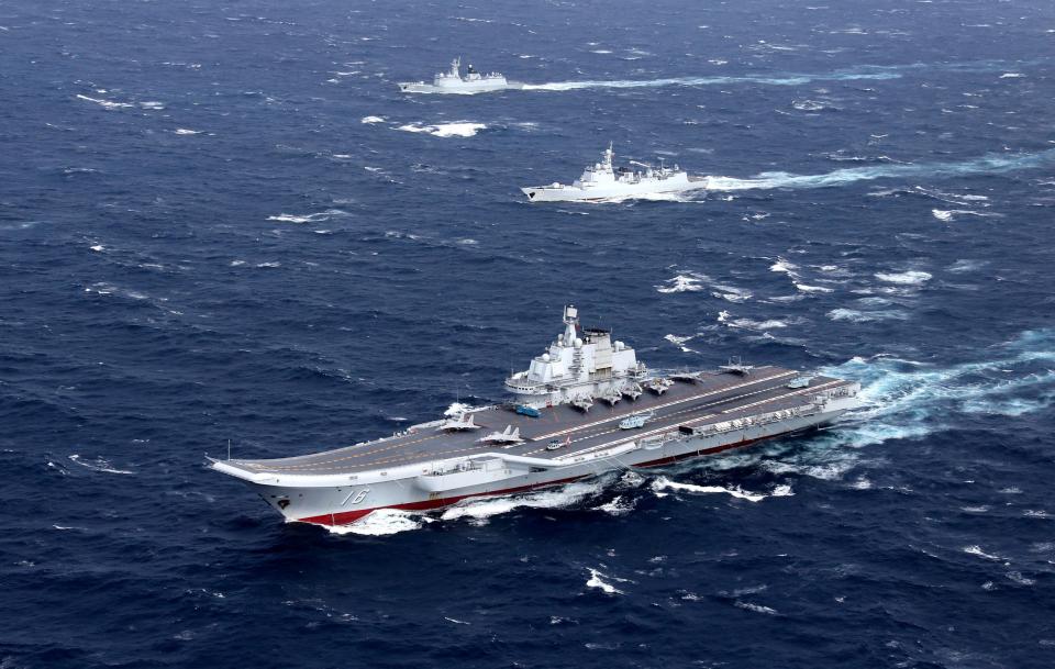 A Chinese aircraft carrier sails over the South China Sea in a drill